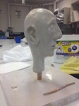 Artist Lynette Webber’s clay sculpted head is a work in progress.